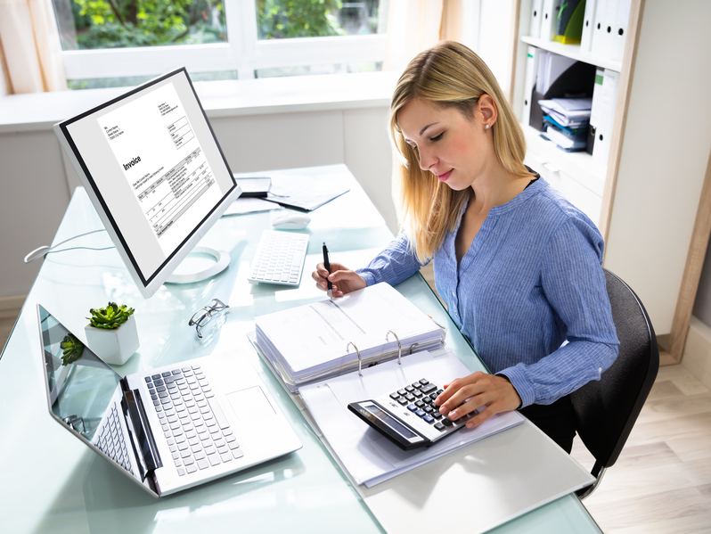 Small business owner managing invoices and accounting