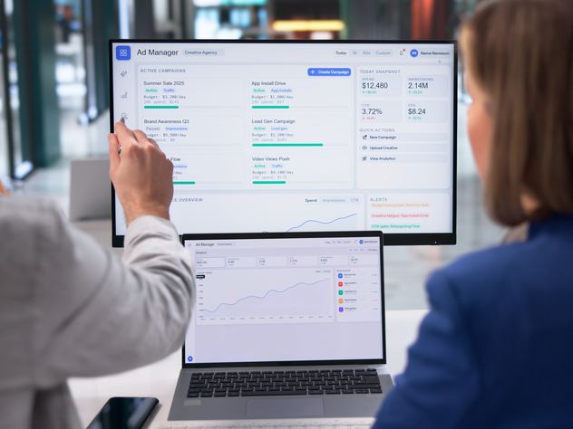 Reviewing social media ad campaign analytics on a monitor